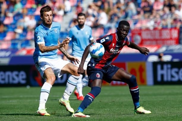 Francesco Acerbi of SS Lazio and Musa Barrow of Bologna Fc battle for the ball during the Serie A match between Bologna FC v SS Lazio at Stadio...
