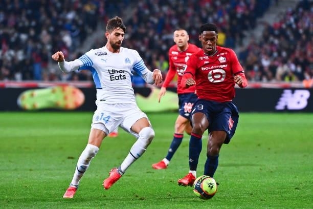 Luan PERES PETRONI of Marseille and Jonathan DAVID of Lille during the Ligue 1 Uber Eats match between Lille and Marseille at Stade Pierre Mauroy on...