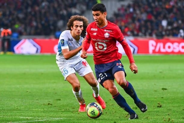 Matteo GUENDOUZI of Marseille and Benjamin ANDRE of Lille during the Ligue 1 Uber Eats match between Lille and Marseille at Stade Pierre Mauroy on...