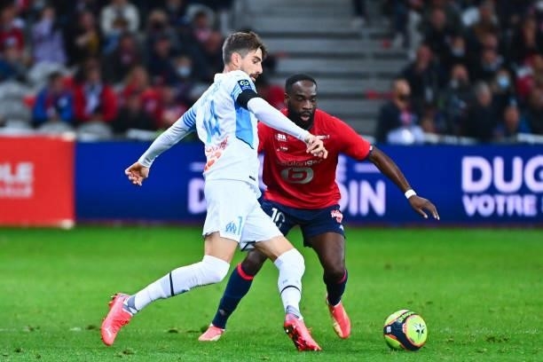 Luan PERES PETRONI of Marseille and Jonathan IKONE of Lille during the Ligue 1 Uber Eats match between Lille and Marseille at Stade Pierre Mauroy on...