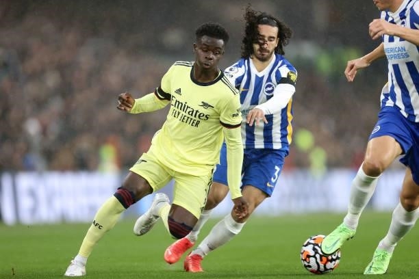 Bukayo Saka of Arsenal and Marc Cucurella of Brighton during the Premier League match between Brighton & Hove Albion and Arsenal at American Express...