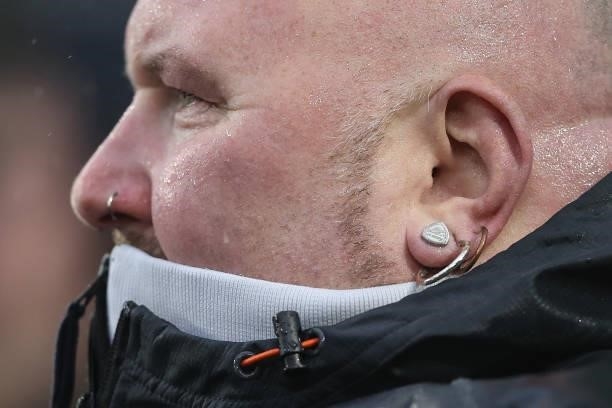 Fan with an Arsenal earring during the Premier League match between Brighton & Hove Albion and Arsenal at American Express Community Stadium on...