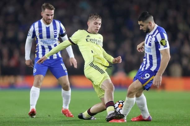 Emile Smith Rowe of Arsenal catches the foot of Neal Maupay of Brighton during the Premier League match between Brighton & Hove Albion and Arsenal at...