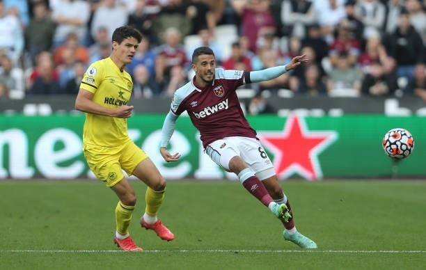 West Ham United's Pablo Fornals and Brentford's Christian Norgaard during the Premier League match between West Ham United and Brentford at London...