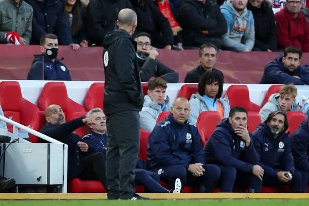 Pep Guardiola the head coach / manager of Manchester City reacts towards Fourth Official Mike Dean during the Premier League match between Liverpool...