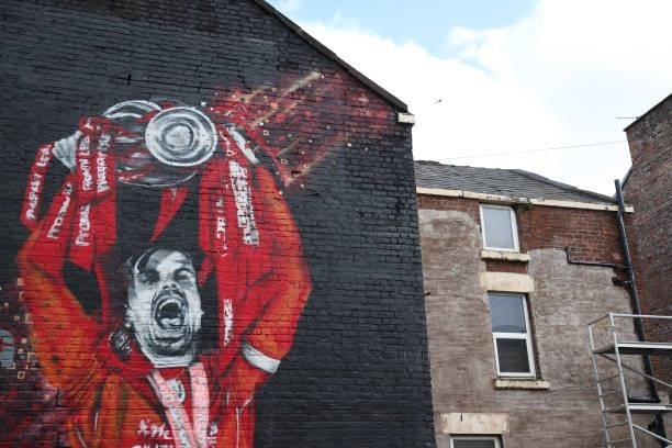 Mural of Jordan Henderson of Liverpool lifting the Premier League trophy is seen ahead of the Premier League match between Liverpool and Manchester...