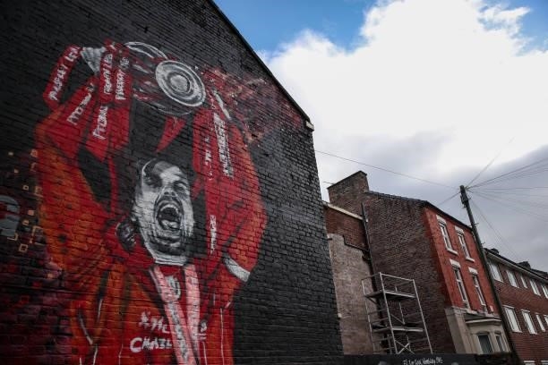 Mural of Jordan Henderson of Liverpool lifting the Premier League trophy is seen ahead of the Premier League match between Liverpool and Manchester...