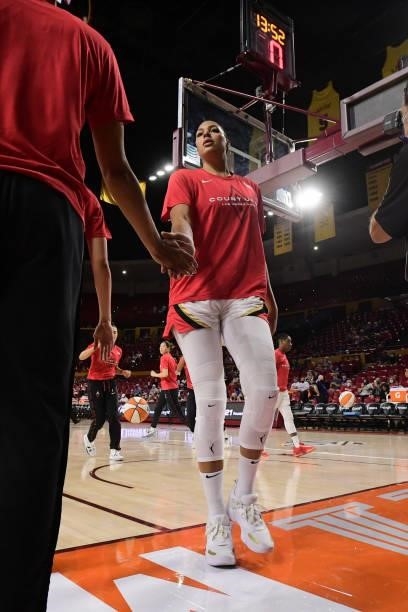 Liz Cambage of the Las Vegas Aces high fives her teammate before the game against the Phoenix Mercury during Game Three of the 2021 WNBA Semifinals...