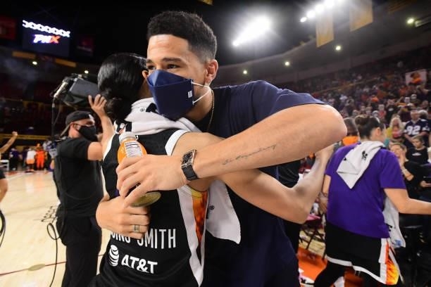 Devin Booker of the Phoenix Suns hugs Skylar Diggins-Smith of the Phoenix Mercury after the game against the Las Vegas Aces during Game Three of the...
