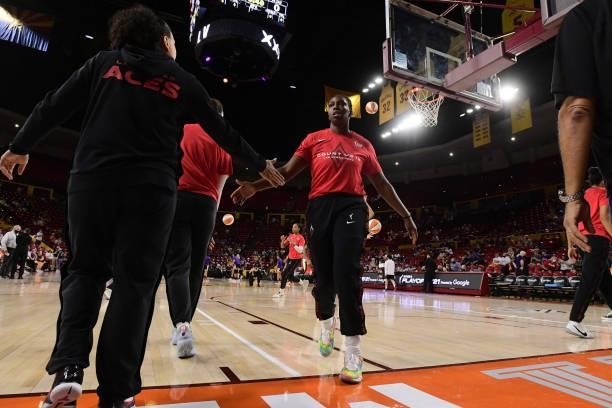 Chelsea Gray of the Las Vegas Aces high fives her teammate before the game against the Phoenix Mercury during Game Three of the 2021 WNBA Semifinals...