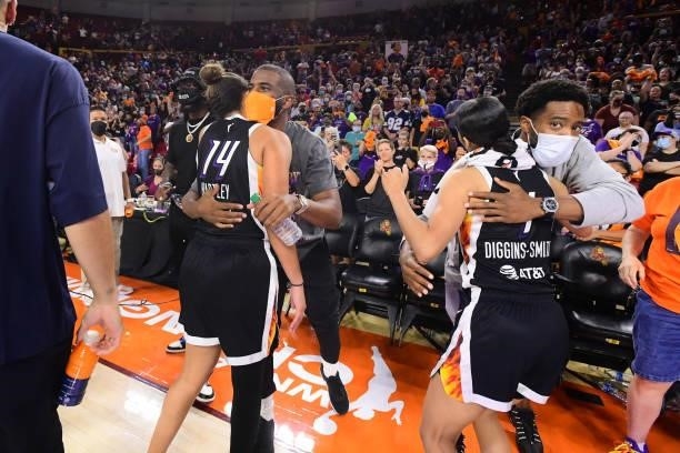 Chris Paul and Chasson Randle of the Phoenix Suns hug Bria Hartley and Skylar Diggins-Smith of the Phoenix Mercury after the game against the Las...