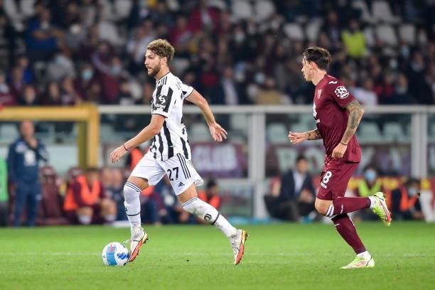 Manuel Locatelli of Juventus and Daniele Baselli of Torino during the Serie A match between Torino FC v Juventus at Stadio Olimpico di Torino on...