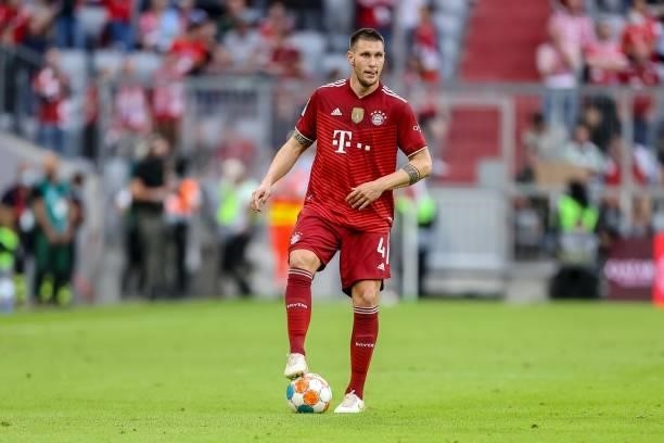 Niklas Suele of Bayern Muenchen controls the ball during the Bundesliga match between FC Bayern Muenchen and Eintracht Frankfurt at Allianz Arena on...