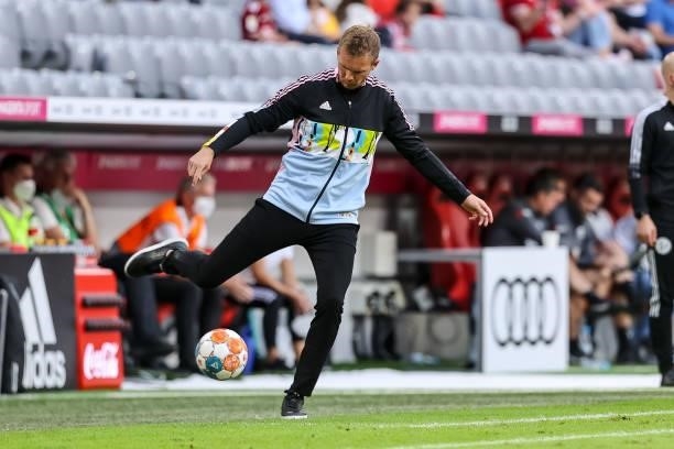 Head coach Julian Nagelsmann of Bayern Muenchen controls the ball during the Bundesliga match between FC Bayern Muenchen and Eintracht Frankfurt at...