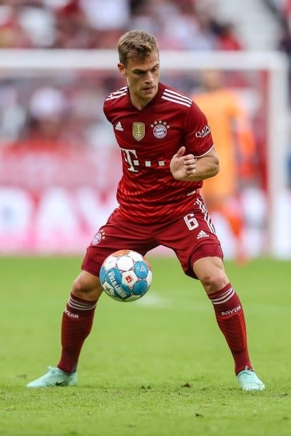 Joshua Kimmich of Bayern Muenchen controls the ball during the Bundesliga match between FC Bayern Muenchen and Eintracht Frankfurt at Allianz Arena...