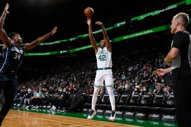 Al Horford of the Boston Celtics shoots a three point basket during the game against the Orlando Magic on October 4, 2021 at the TD Garden in Boston,...