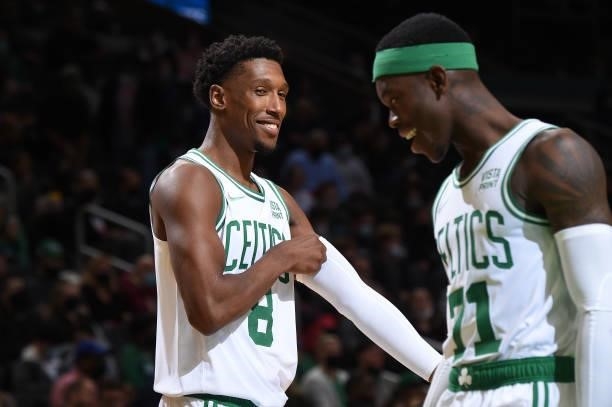 Josh Richardson talks with Dennis Schroder of the Boston Celtics during the game against the Orlando Magic on October 4, 2021 at the TD Garden in...