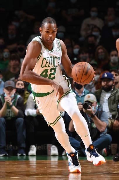 Al Horford of the Boston Celtics dribbles the ball during the game against the Orlando Magic on October 4, 2021 at the TD Garden in Boston,...