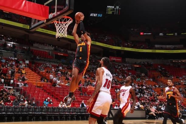 Jalen Johnson of the Atlanta Hawks dunks the ball during a preseason game against the Miami Heat on October 4, 2021 at FTX Arena in Miami, Florida....