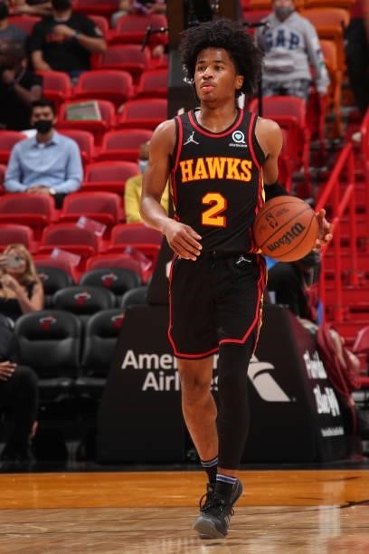 Sharife Cooper of the Atlanta Hawks dribbles the ball during a preseason game against the Miami Heat on October 4, 2021 at FTX Arena in Miami,...