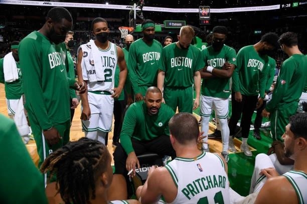 Head Coach Ime Udoka of the Boston Celtics huddles with the team during the game against the Orlando Magic on October 4, 2021 at the TD Garden in...