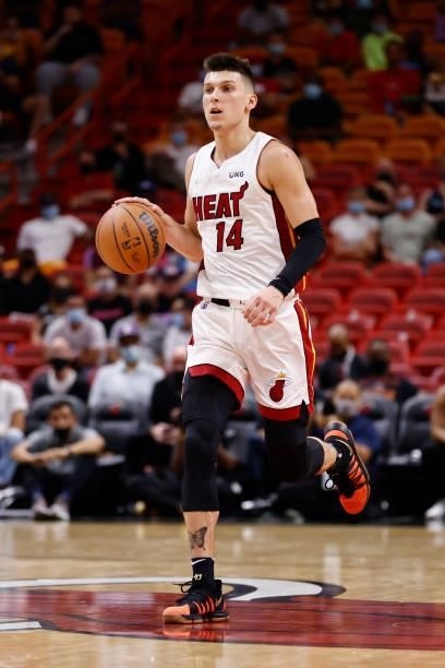 Tyler Herro of the Miami Heat dribbles the ball during a preseason game against the Atlanta Hawks on October 4, 2021 at FTX Arena in Miami, Florida....