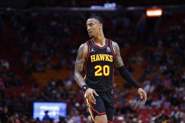 John Collins of the Atlanta Hawks looks on during a preseason game against the Miami Heat on October 4, 2021 at FTX Arena in Miami, Florida. NOTE TO...