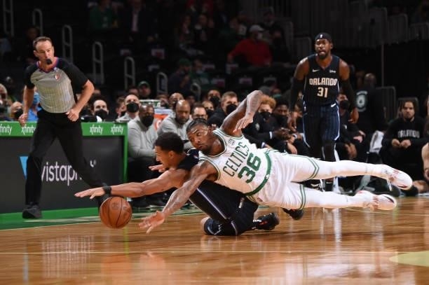 Marcus Smart of the Boston Celtics dives for the ball during the game against the Orlando Magic on October 4, 2021 at the TD Garden in Boston,...