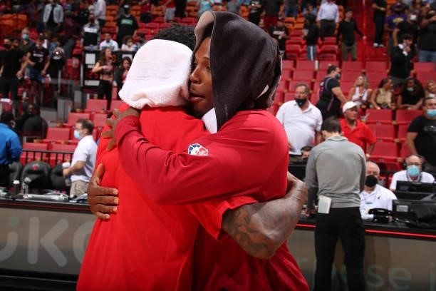 Kyle Lowry of the Miami Heat hugs Lou Williams of the Atlanta Hawks after a preseason game on October 4, 2021 at FTX Arena in Miami, Florida. NOTE TO...