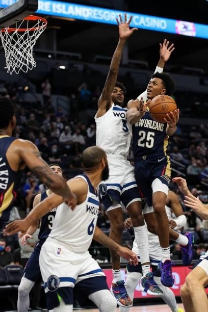 Trey Murphy III of the New Orleans Pelicans goes up for a shot while Jaden McDaniels of the Minnesota Timberwolves defends in the fourth quarter of a...