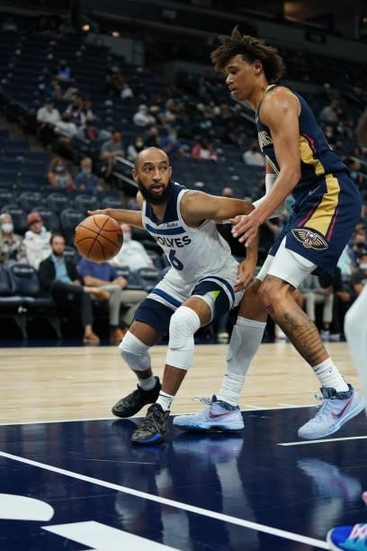 Jordan McLaughlin of the Minnesota Timberwolves drives to the basket during a preseason game against the New Orleans Pelicans on October 4, 2021 at...