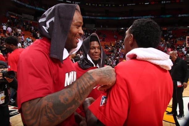 Tucker of the Miami Heat and Kyle Lowry of the Miami Heat talk with Lou Williams of the Atlanta Hawks after a preseason game on October 4, 2021 at...