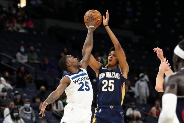 McKinley Wright IV of the Minnesota Timberwolves blocks a shot by Trey Murphy III of the New Orleans Pelicans in the fourth quarter of a preseason...
