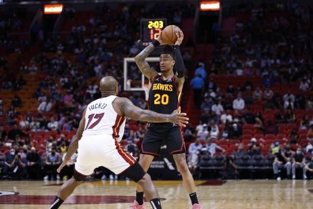 John Collins of the Atlanta Hawks handles the ball during a preseason game against the Miami Heat on October 4, 2021 at FTX Arena in Miami, Florida....
