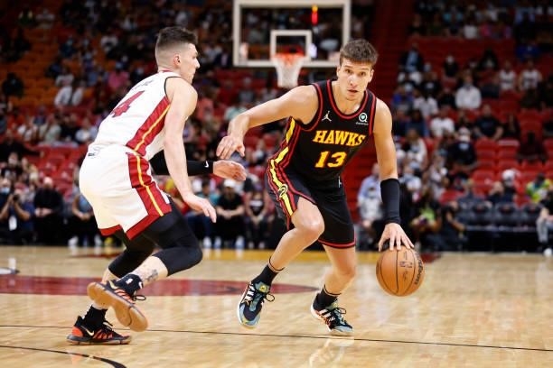 Bogdan Bogdanovic of the Atlanta Hawks dribbles the ball during a preseason game against the Miami Heat on October 4, 2021 at FTX Arena in Miami,...