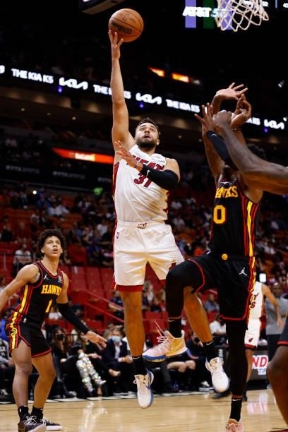Max Strus of the Miami Heat shoots the ball during a preseason game against the Atlanta Hawks on October 4, 2021 at FTX Arena in Miami, Florida. NOTE...