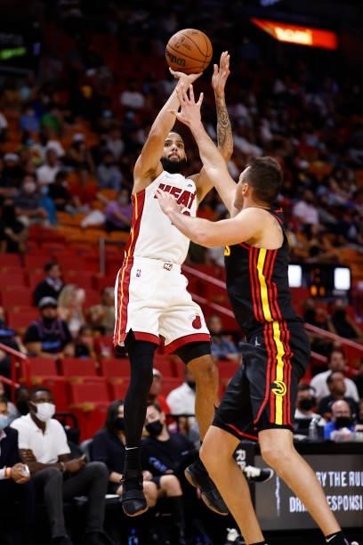 Caleb Martin of the Miami Heat shoots the ball during a preseason game against the Atlanta Hawks on October 4, 2021 at FTX Arena in Miami, Florida....