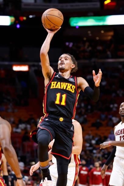Trae Young of the Atlanta Hawks shoots the ball during a preseason game against the Miami Heat on October 4, 2021 at FTX Arena in Miami, Florida....