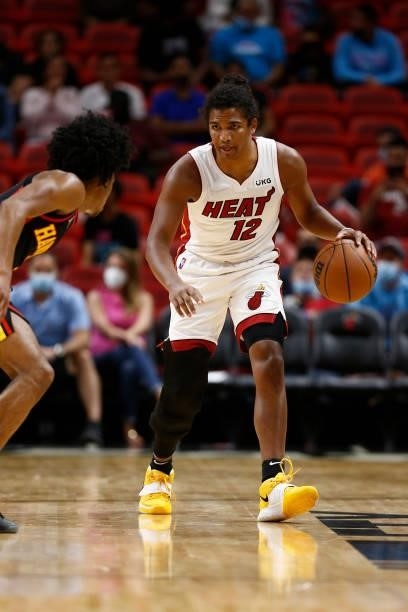 Dru Smith of the Miami Heat dribbles the ball during a preseason game against the Atlanta Hawks on October 4, 2021 at FTX Arena in Miami, Florida....