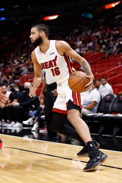 Caleb Martin of the Miami Heat drives to the basket during a preseason game against the Atlanta Hawks on October 4, 2021 at FTX Arena in Miami,...