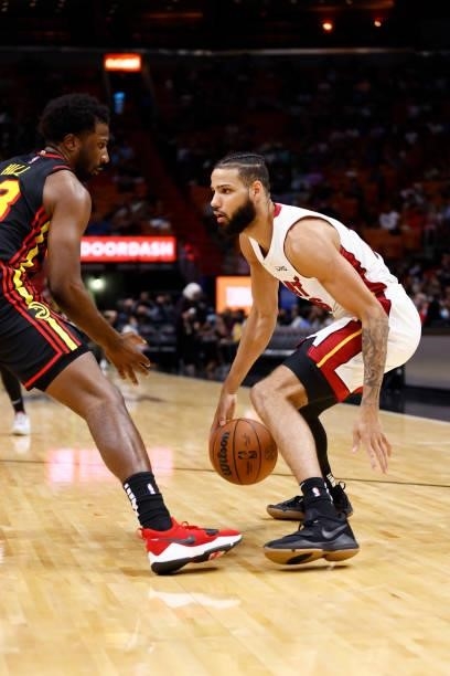 Caleb Martin of the Miami Heat handles the ball during a preseason game against the Atlanta Hawks on October 4, 2021 at FTX Arena in Miami, Florida....