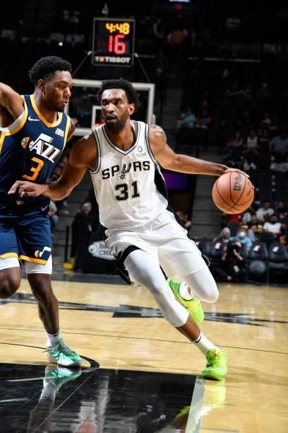 Keita Bates-Diop of the San Antonio Spurs drives to the basket against the Utah Jazz during a pre-season game on October 4, 2021 at the AT&T Center...