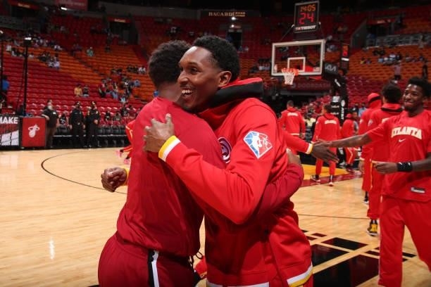 Lou Williams of the Atlanta Hawks hugs Kyle Lowry of the Miami Heat before a preseason game on October 4, 2021 at FTX Arena in Miami, Florida. NOTE...