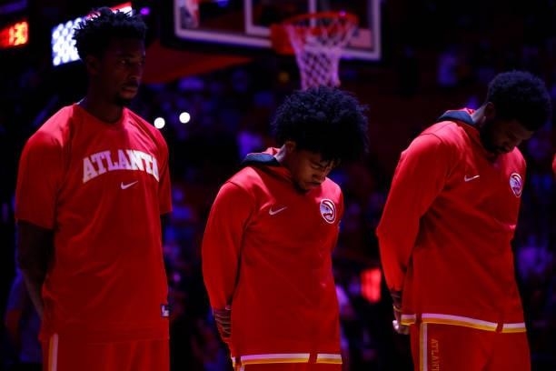 Sharife Cooper of the Atlanta Hawks stands with teammates for the national anthem before the preseason game against the Miami Heat on October 4, 2021...