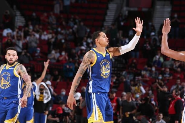 Juan Toscano-Anderson of the Golden State Warriors hi-fives teammates during the game against the Portland Trail Blazers on October 4, 2021 at the...