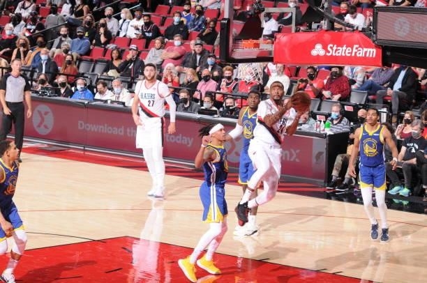 Norman Powell of the Portland Trail Blazers shoots the ball during the game against the Golden State Warriors on October 4, 2021 at the Moda Center...