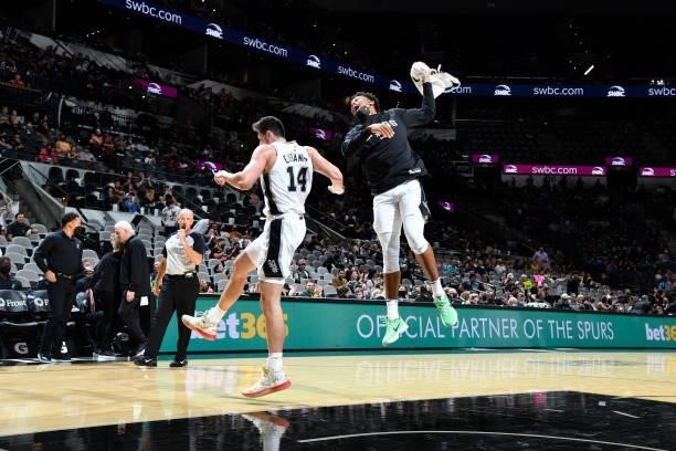 Drew Eubanks and Keldon Johnson of the San Antonio Spurs react to a play during the game against the Utah Jazz during a pre-season game on October 4,...