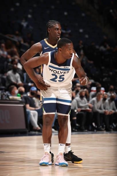 Kira Lewis Jr. #13 of the New Orleans Pelicans and McKinley Wright IV of the Minnesota Timberwolves look on during a pre-season game on October 4,...