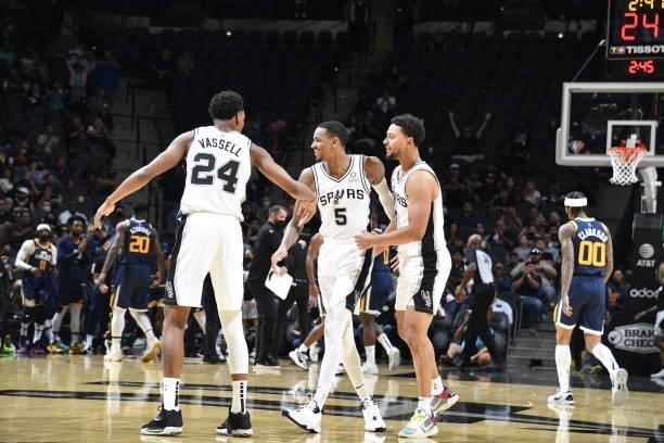 Dejounte Murray of the San Antonio Spurs smiles during the game against the Utah Jazz during a pre-season game on October 4, 2021 at the AT&T Center...
