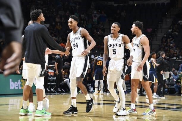 Devin Vassell and Dejounte Murray of the San Antonio Spurs smile during the game against the Utah Jazz during a pre-season game on October 4, 2021 at...